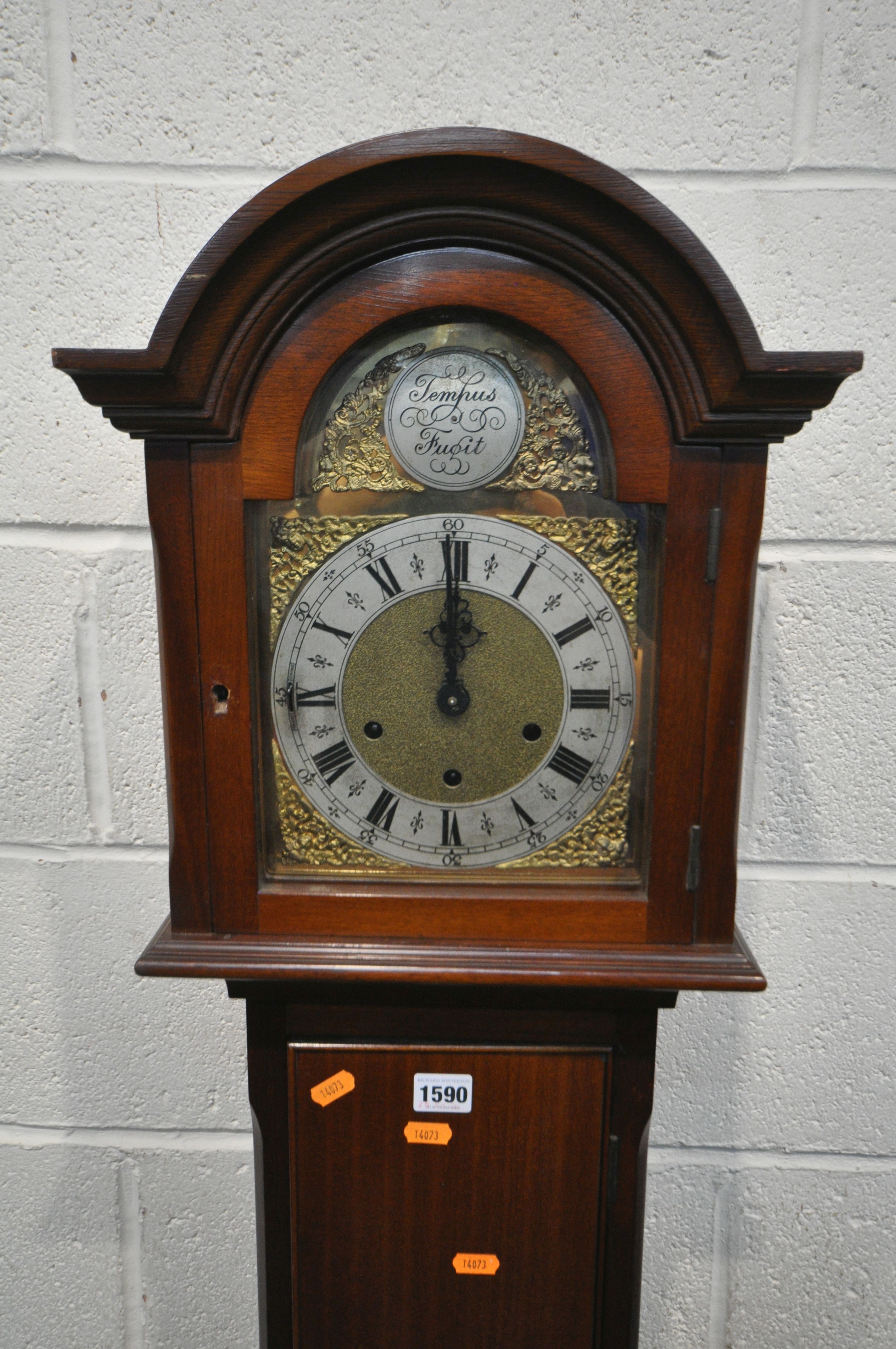 A 20TH CENTURY MAHOGANY CHIMING GRANDAUGHTER CLOCK, the arched door enclosing a brass and silvered 7 - Image 2 of 4