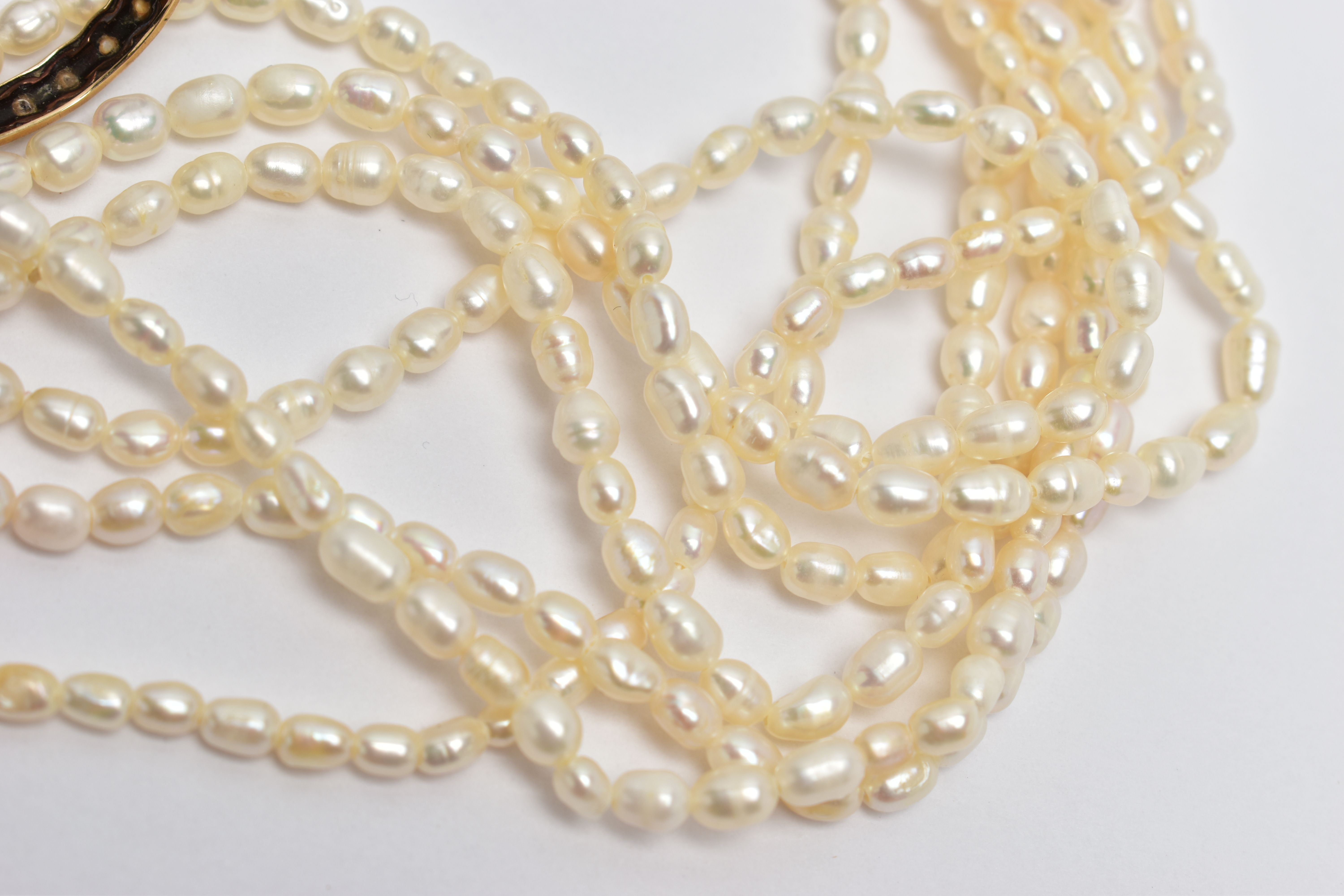 A YELLOW METAL FULL ETERNITY RING AND A CULTURED PEARL NECKLACE, worn yellow metal full eternity - Image 4 of 5