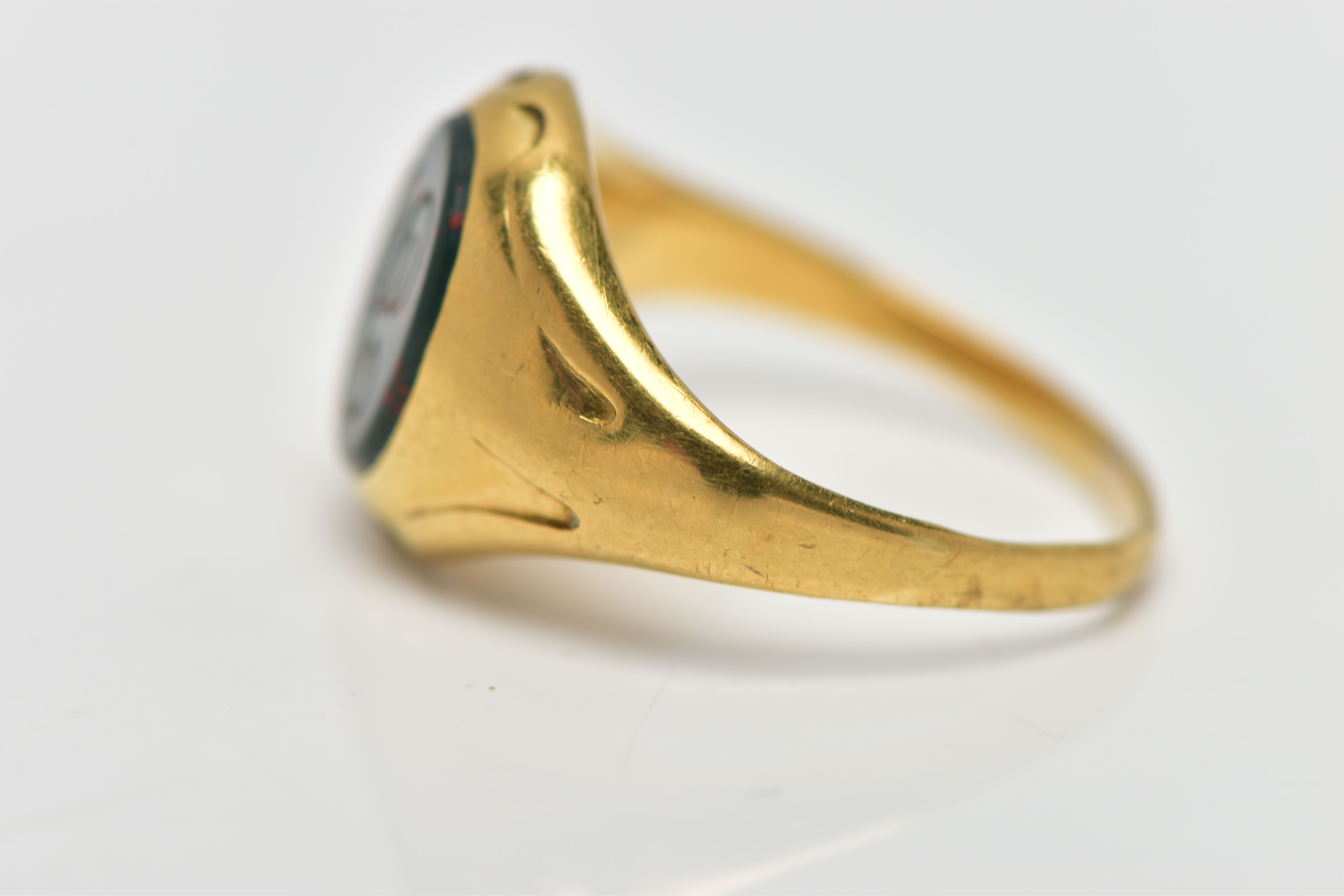 AN 18CT GOLD SIGNET RING, set with an oval bloodstone insert with an engraved initial 'C', worn - Image 2 of 4