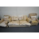 A WICKER SIX PIECE CONSERVATORY SUITE, comprising a three seater sofa, two various armchairs, a