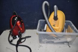 A MOULINEX POWERSTAR CN2 VACUUM CLEANER with accessories and a Ewbank steam dynamo steam cleaner (