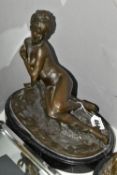 A MODERN BRONZE FIGURINE, 'Young woman bathing' (after Mme. Leon Bertaux) on an oval black marble