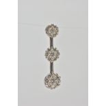 A 9CT WHITE GOLD DIAMOND CLUSTER PENDANT, comprising of three graduated brilliant cut diamond floral