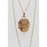 A 9CT GOLD OVAL LOCKET AND CHAIN, oval floral decorated locket, opens to reveal two vacant