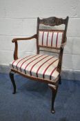 A 19TH CENTURY ROSEWOOD AND MARQUETRY INLAID ELBOW CHAIR, on cabriole front legs, with stripped