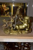 A GILT BRONZE FIGURINE OF A CHERUB, a reclining Cherub and a goat next to a grapevine, height 24cm x