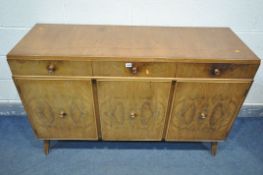 A MID CENTURY WALNUT SIDEBOARD, with three drawers above three cupboard doors, length 135cm x