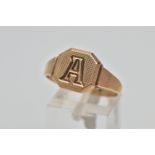 A 9CT GOLD SIGNET RING, square signet with cut off corners, engine turned design with engraved