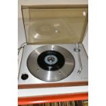 A BANG AND OLUFSEN BEOGRAM 1202 TURNTABLE with a teak veneered plinth, lightly smoked Plexiglass