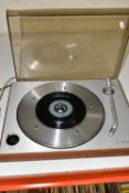 A BANG AND OLUFSEN BEOGRAM 1202 TURNTABLE with a teak veneered plinth, lightly smoked Plexiglass