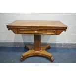 A VICTORIAN ROSEWOOD CARD TABLE, the fold over top enclosing a circular green baize playing surface,