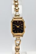 A LADIES 1950's 'ACCURIST' WRISTWATCH WITH 9CT GOLD STRAP, the octagonal black dial, signed '