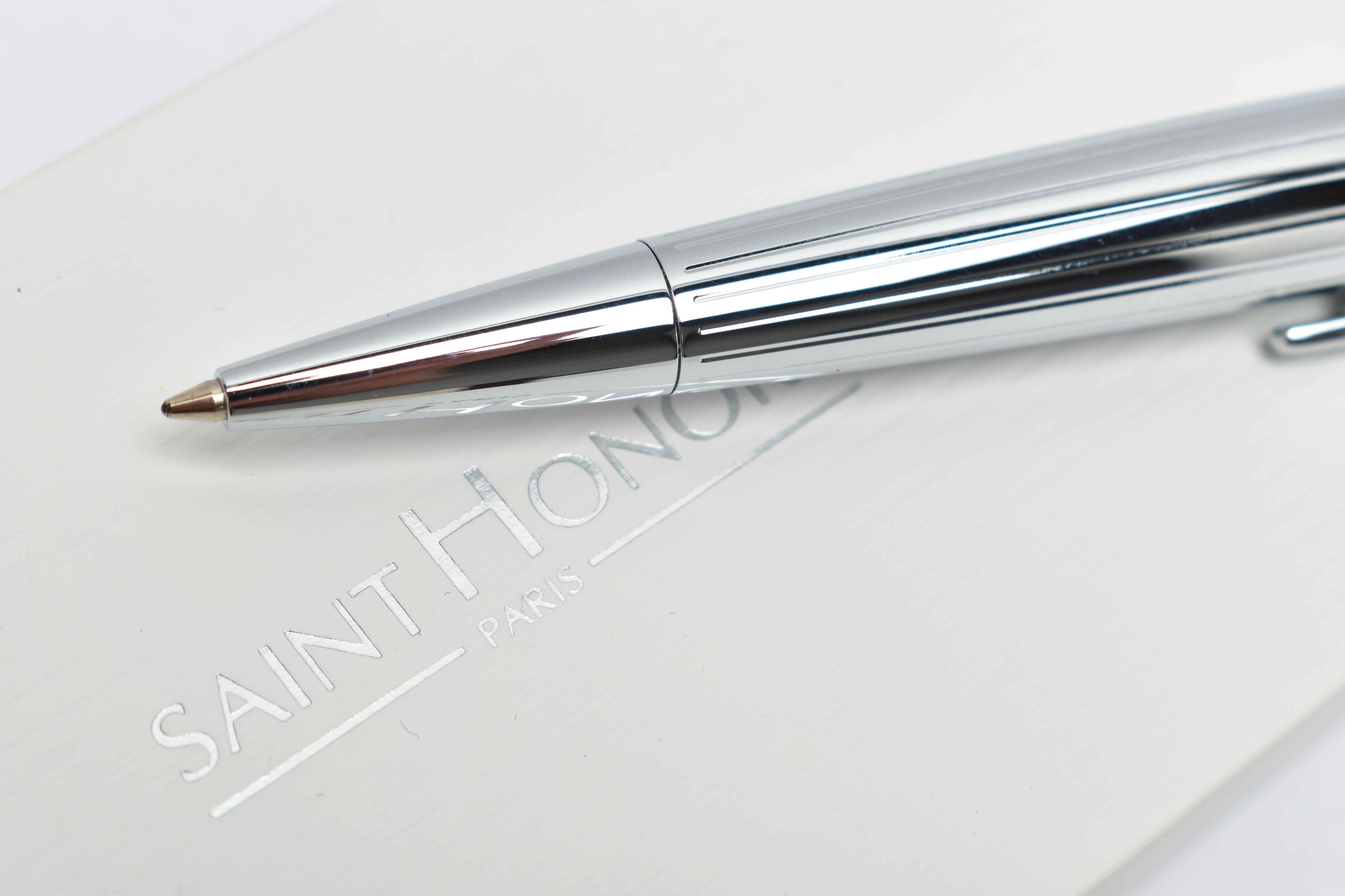 A SAINT HONORE BALLPOINT PEN, a white metal twist weighted pen, detailed with a linear grooved - Image 2 of 3