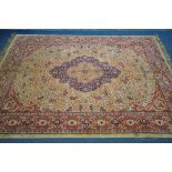 A TURKISH KAYSERI HAND KNOTTED CARPET, red and orange ground, with a central medallion and multi