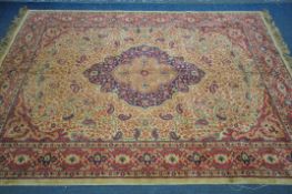 A TURKISH KAYSERI HAND KNOTTED CARPET, red and orange ground, with a central medallion and multi