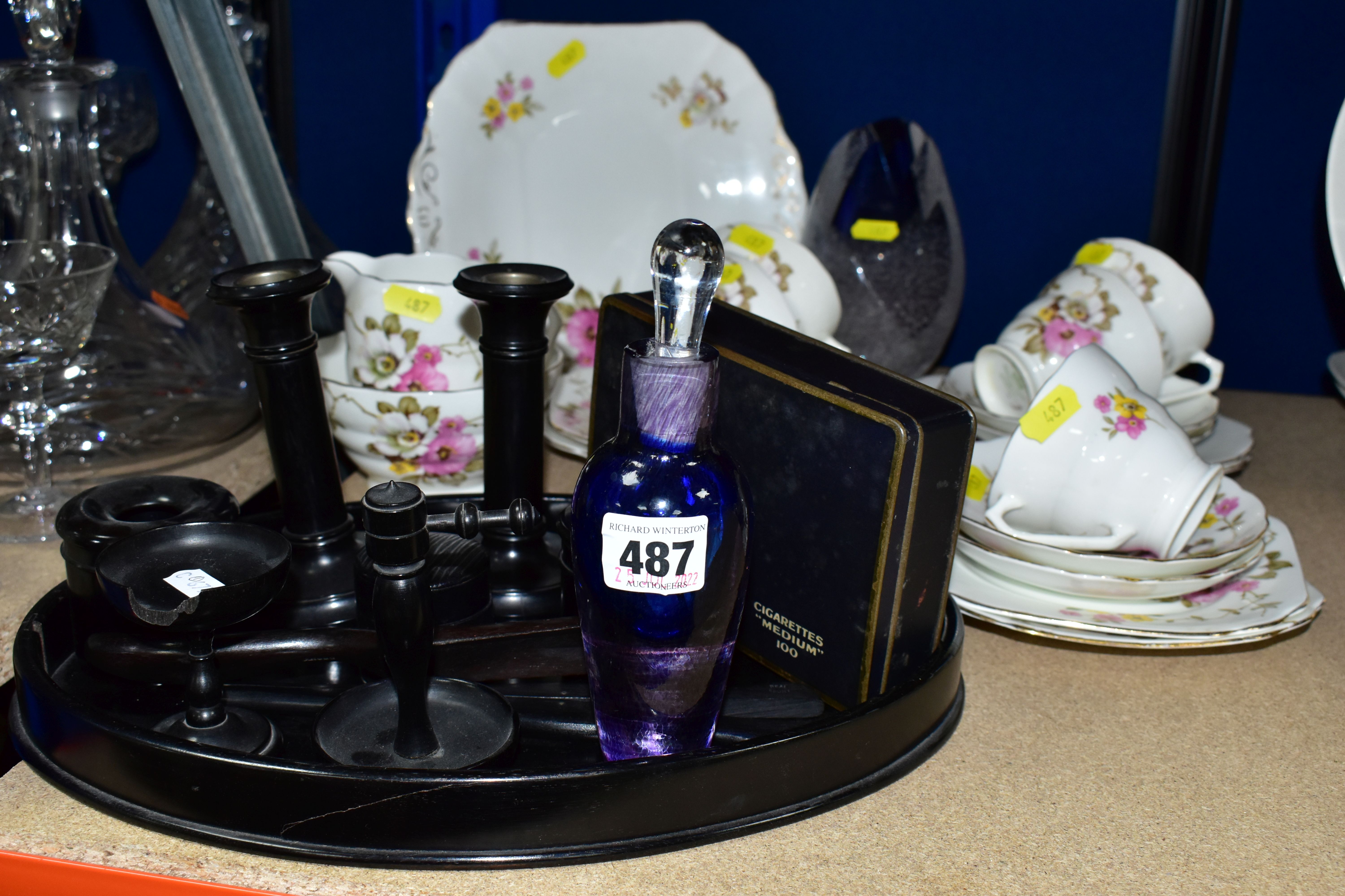 A GENTLEMAN'S EBONY VANITY SET, to include an oval tray, length 32cm x width 22cm - hairline split