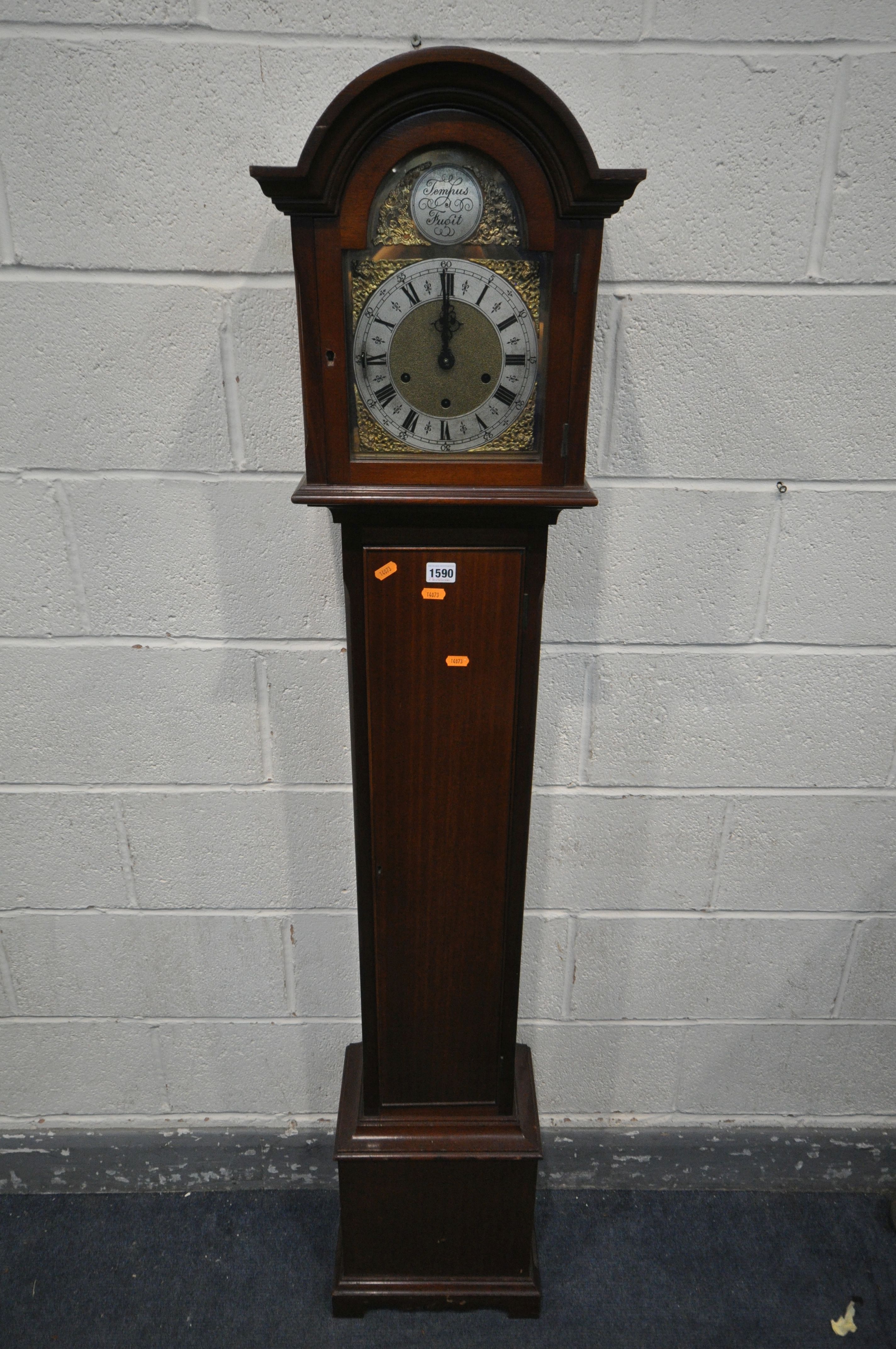 A 20TH CENTURY MAHOGANY CHIMING GRANDAUGHTER CLOCK, the arched door enclosing a brass and silvered 7