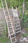 TWO SETS OF WOODEN STEP LADDERS, tallest 214cm together with a wooden ladder, height 3.4m (