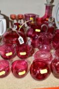 A COLLECTION OF CRANBERRY GLASSWARE, comprising two cut glass decanters, height 26cm, 15cm, with