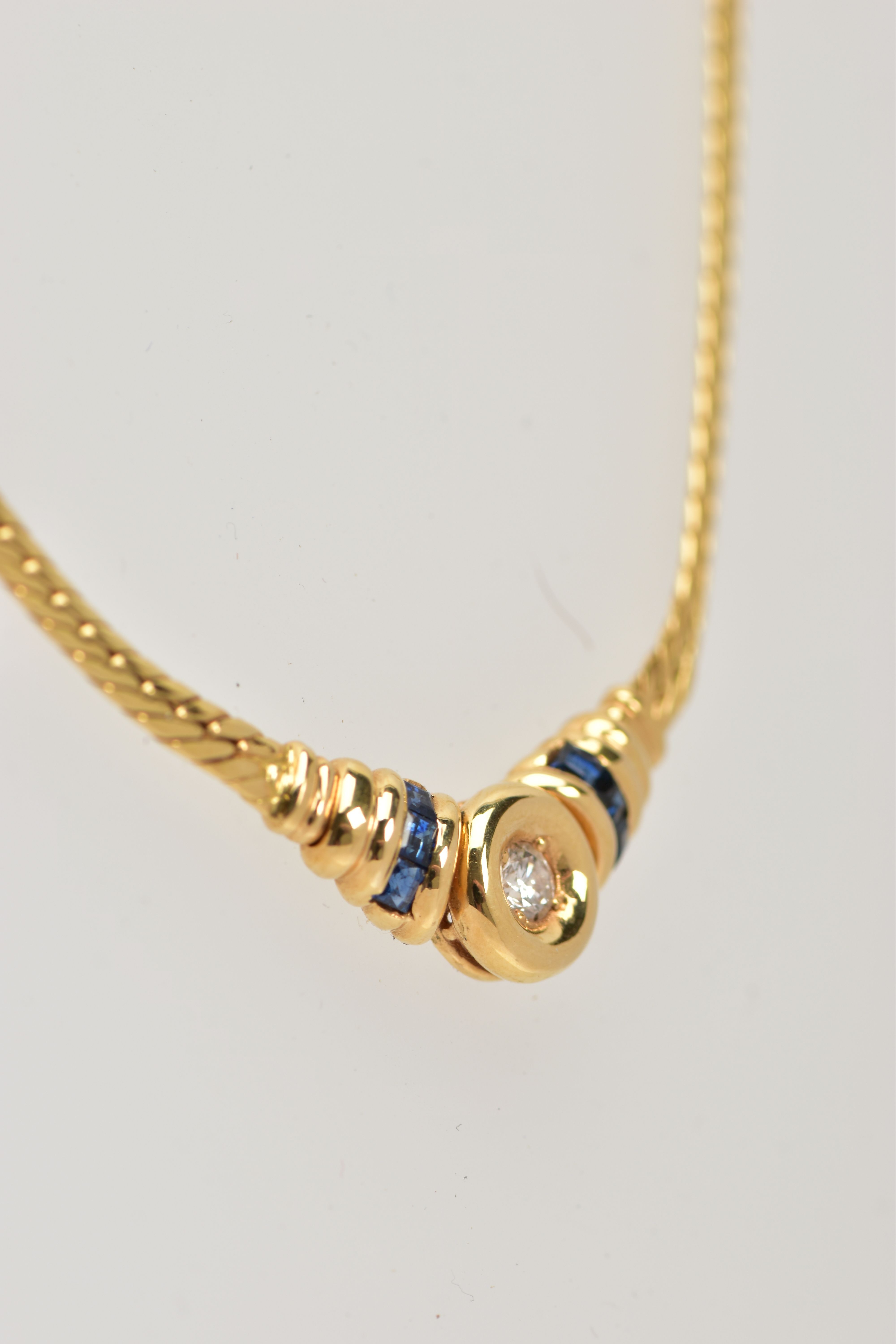 A YELLOW METAL DIAMOND AND SAPPHIRE NECKLACE, an articulated flat link chain fitted with a claw - Image 3 of 4