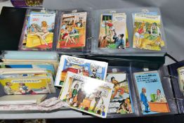 A LARGE COLLECTION OF VINTAGE POSTCARDS, comprising two albums containing four hundred Bamforth