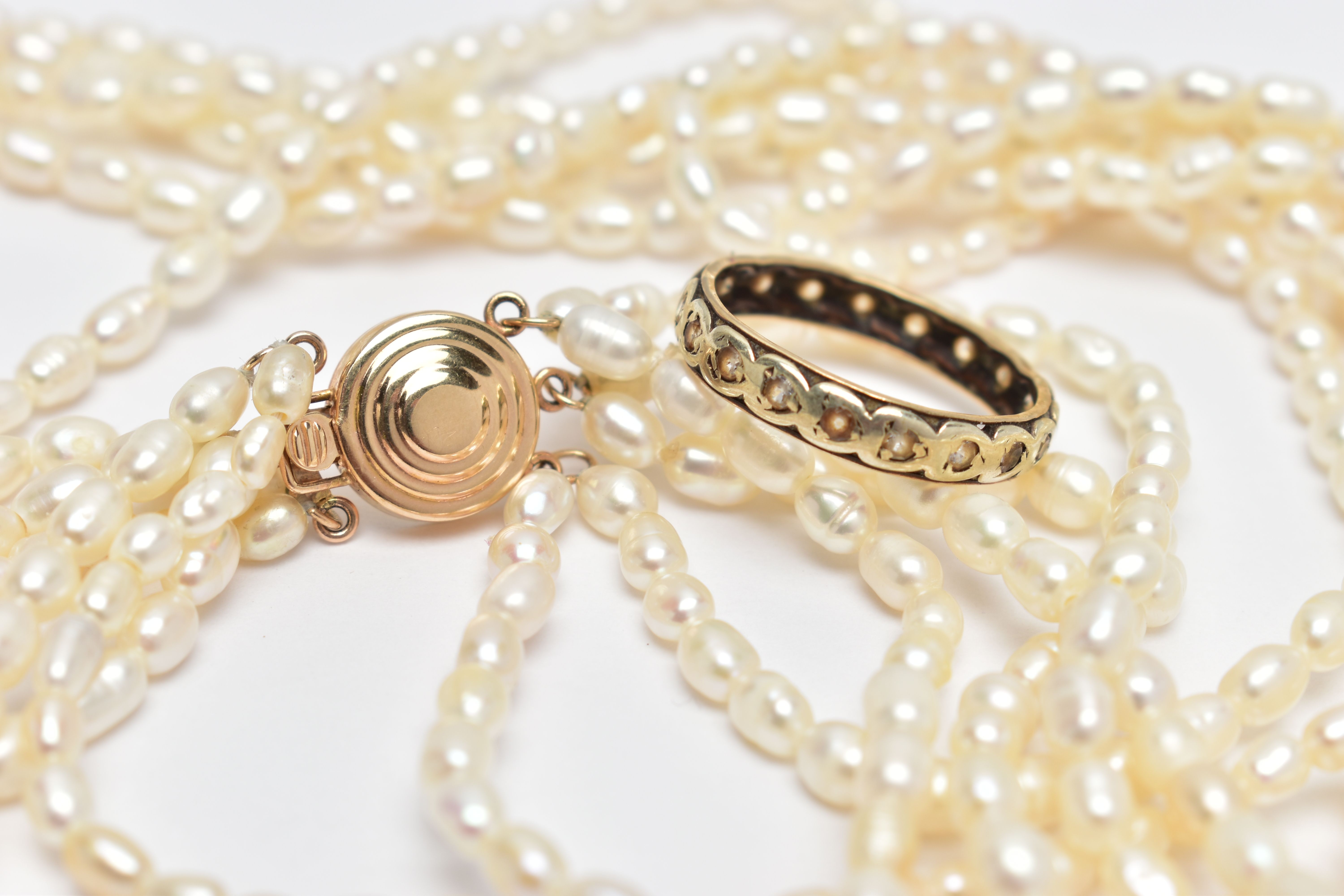 A YELLOW METAL FULL ETERNITY RING AND A CULTURED PEARL NECKLACE, worn yellow metal full eternity - Image 5 of 5