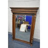 A 20TH CENTURY FRENCH WALNUT BEVELLED EDGE OVERMANTEL MIRROR, with fluted columns, width 99cm x