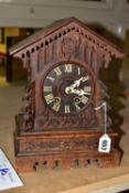 AN OAK CASED MANTLE CUCKOO CLOCK, has the original key and cuckoo still calls on the hour, white