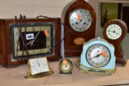 A GROUP OF SIX CLOCKS, comprising two wooden cased mantel/desk clocks with inlaid details, a