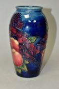 A MOORCROFT 'FINCHES' PATTERN BALUSTER VASE, depicting birds and fruit, impressed and painted