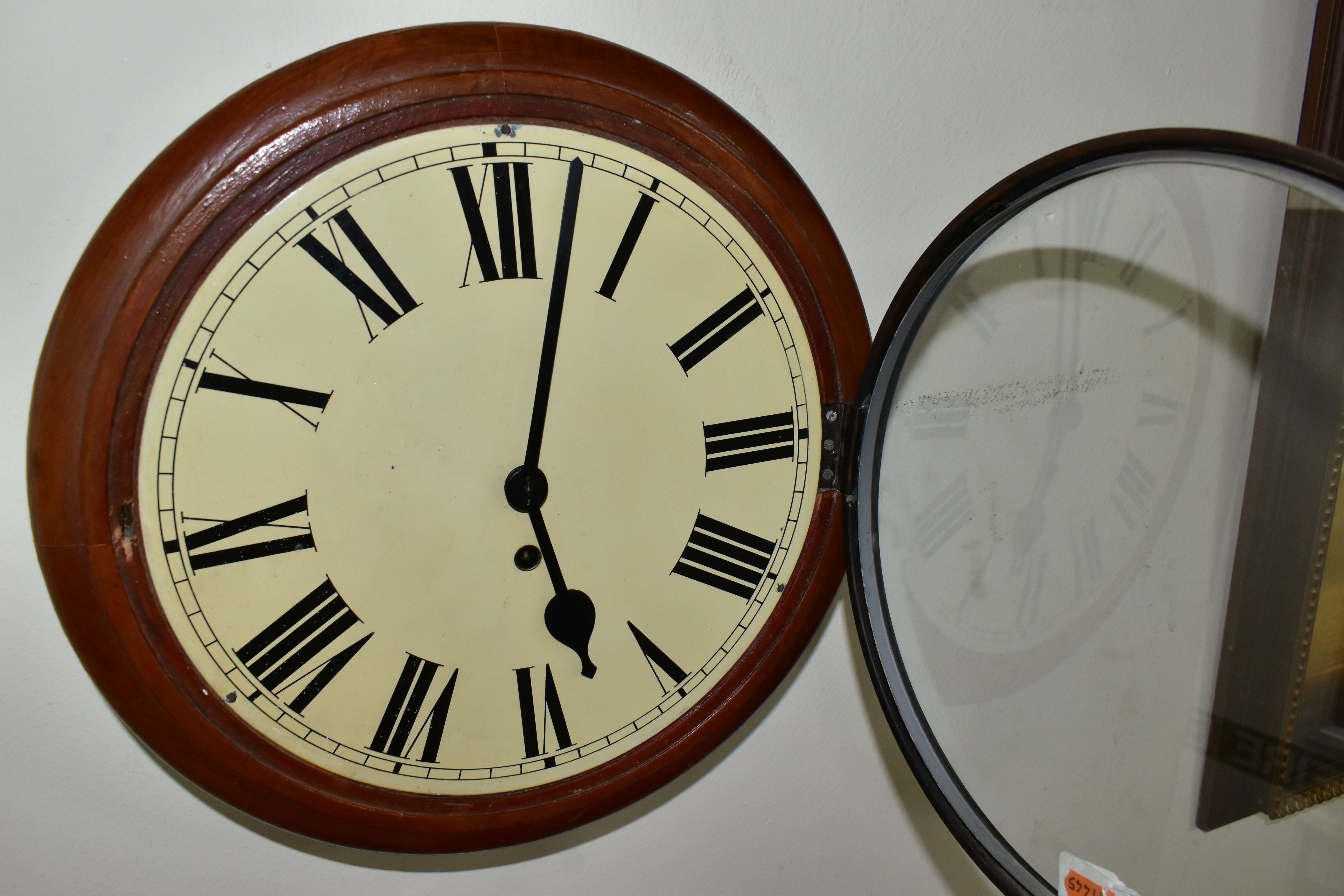 AN EARLY 20TH CENTURY CIRCULAR WALL CLOCK, 'train station style' with pendulum and key, Roman - Image 4 of 4