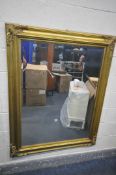 A LARGE LATE 20TH CENTURY GILT FRAMED BEVELLED EDGE WALL MIRROR, 117cm x 148cm