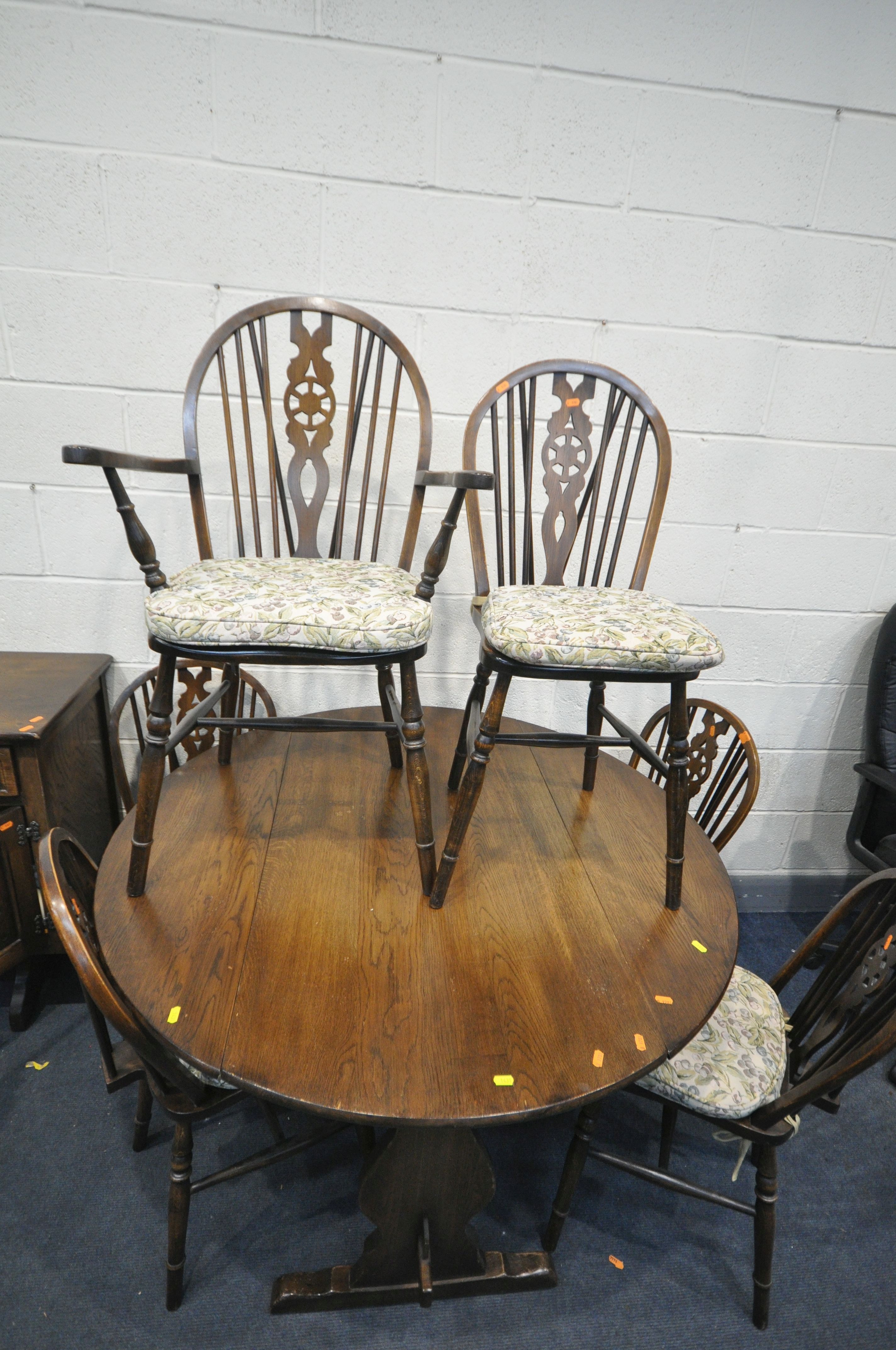 A 20TH CENTURY OAK CIRCULAR DROP LEAF TABLE, with trestle legs, united by a single stretcher, - Image 2 of 3