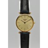 A LADIES 'LONGINES' WRISTWATCH, quartz movement, round champagne dial, signed 'Longines Swiss made',