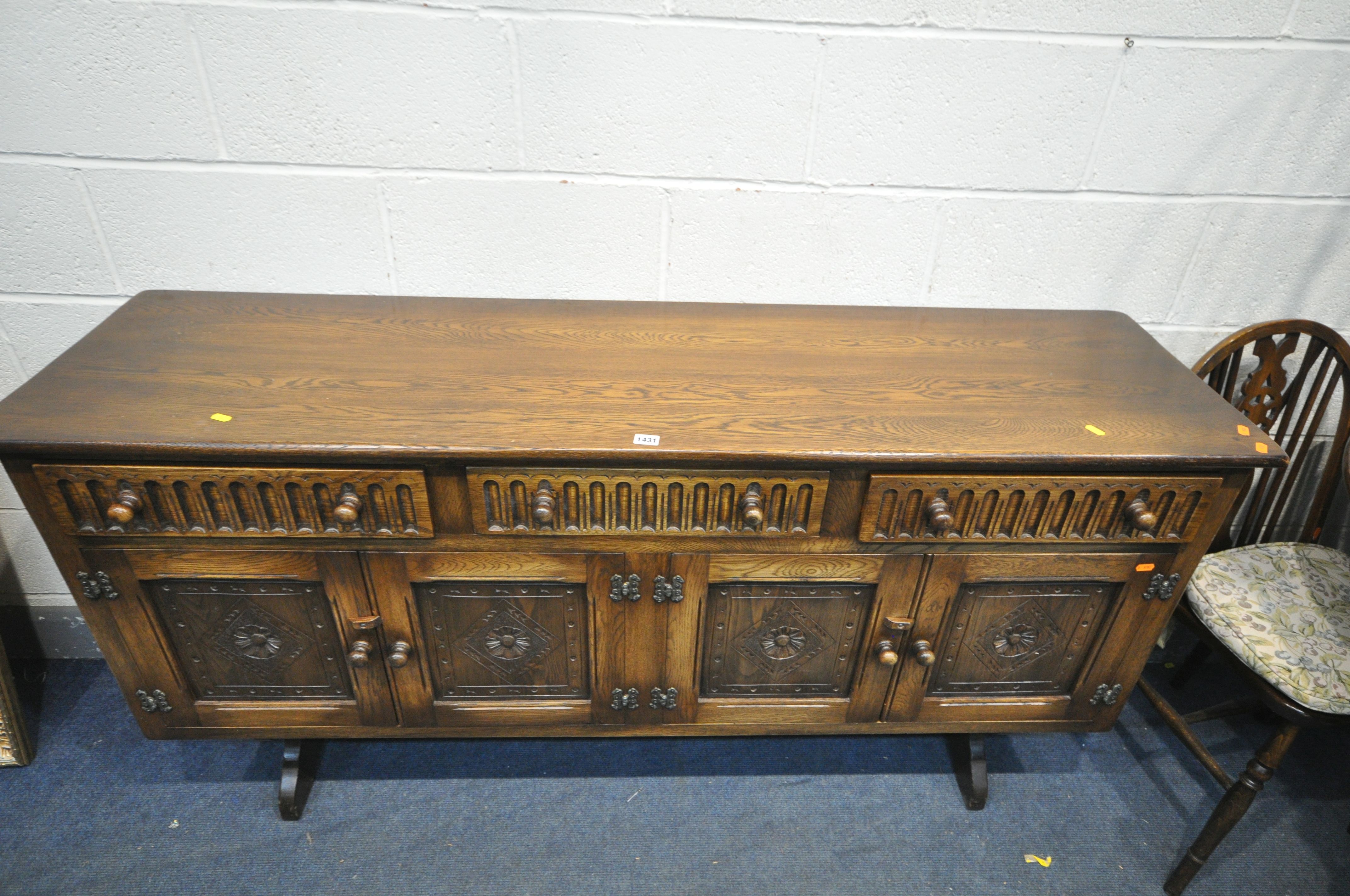 A 20TH CENTURY OAK CIRCULAR DROP LEAF TABLE, with trestle legs, united by a single stretcher, - Image 3 of 3