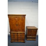 A YEWWOOD TWO DOOR TV CABINET, enclosing a slide and drawers, over double cupboard doors, width