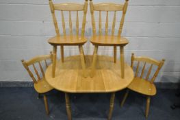 A BEECH CIRCULAR EXTENDING KITCHEN TABLE, with one fold out leaf, open length 120cm x diameter