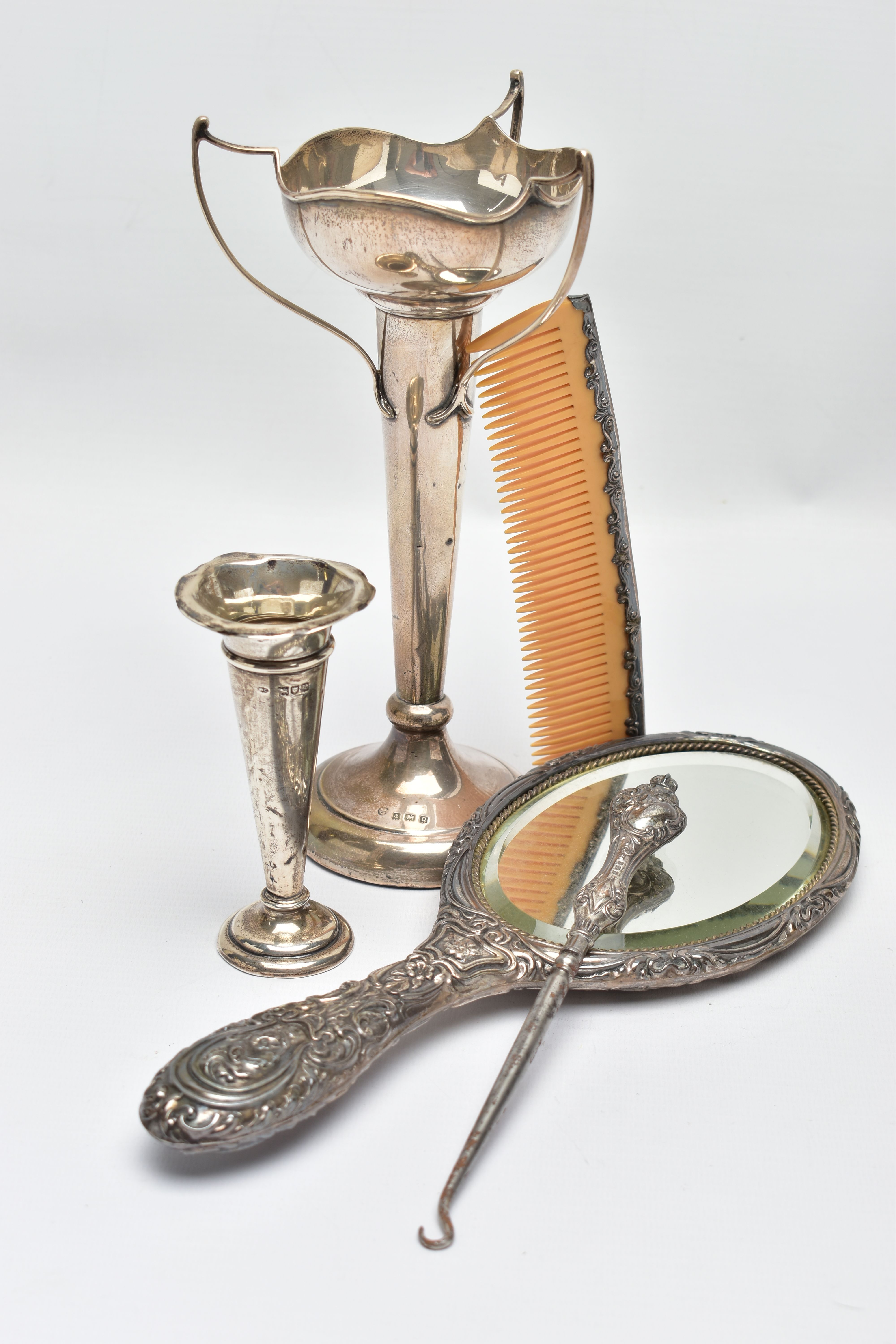 A SELECTION OF EARLY TO MID 20TH CENTURY SILVER, to include a scroll and floral embossed hand - Image 5 of 6