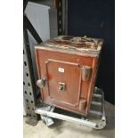 A SMALL VINTAGE CAST IRON SAFE, with key, width 36cm x depth 37cm x height 44cm (condition:-paint