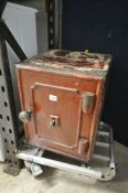 A SMALL VINTAGE CAST IRON SAFE, with key, width 36cm x depth 37cm x height 44cm (condition:-paint