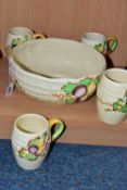 A CLARICE CLIFF 'FRUIT BASKET' FRUIT BOWL AND FOUR MUGS, with relief moulded fruits and