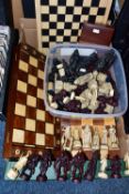 TWO BOXES OF CHESS BOARDS, SET AND PIECES, comprising a folding chess board fitted with wooden