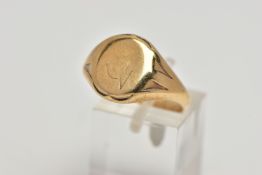 A 9CT GOLD SIGNET RING, oval signet with worn engraving, textured shoulders leading onto a