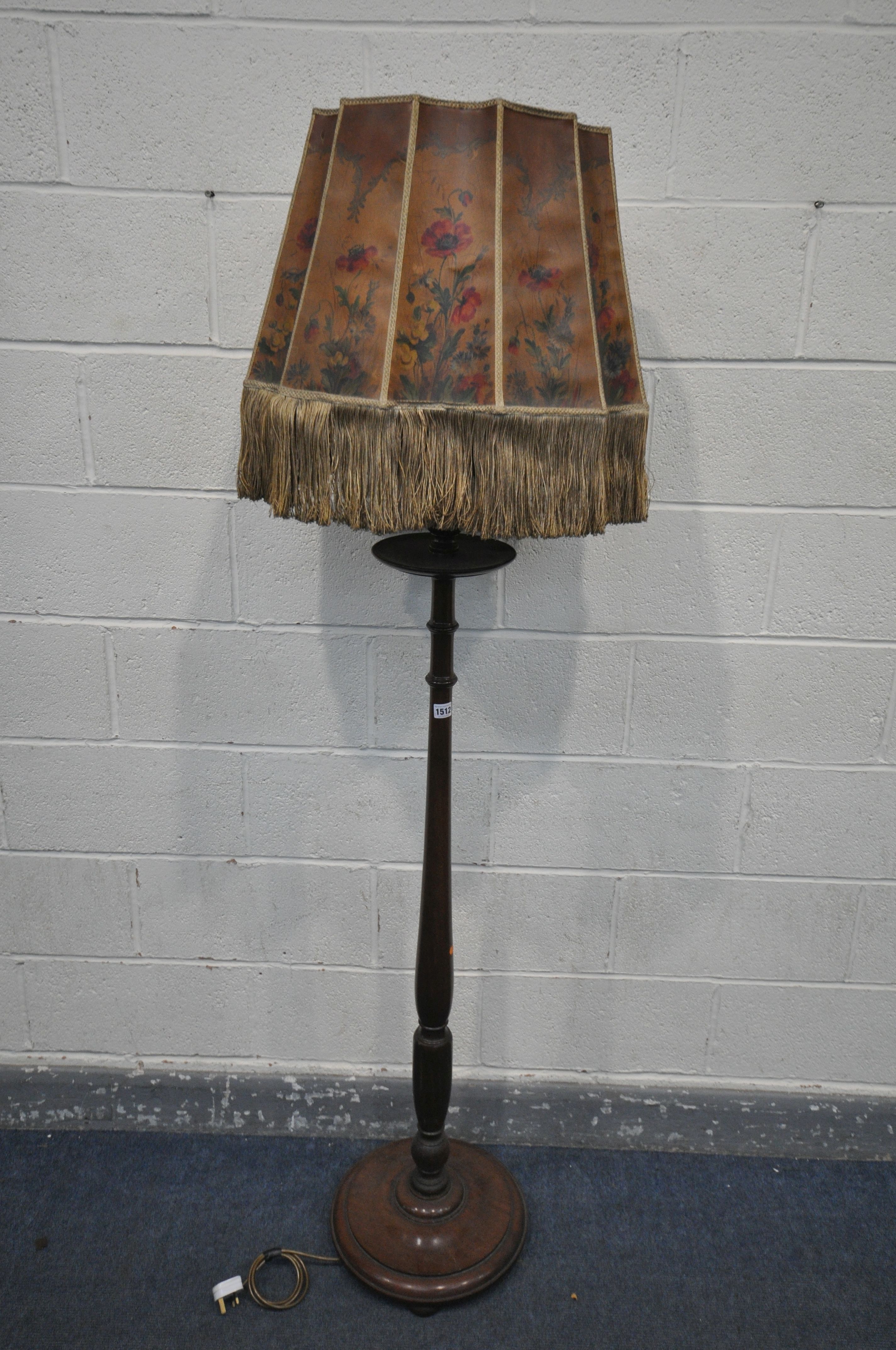 AN EARLY 20TH CENTURY MAHOGANY STANDARD LAMP, with a single shelf, hand painted shade, height with