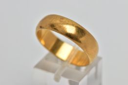 A YELLOW METAL WIDE BAND RING, plain polished wide band, approximate width 6.2mm, stamped '18ct',