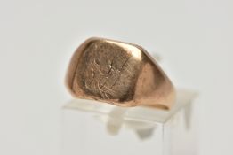 A YELLOW METAL SIGNET RING, square polished signet with worn engraved initials, tapered polished