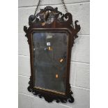 A GEORGE III STYLE MAHOGANY FRETWORK WALL MIRROR, with an openwork gilt phoenix crest above the