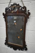 A GEORGE III STYLE MAHOGANY FRETWORK WALL MIRROR, with an openwork gilt phoenix crest above the