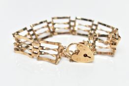 A 9CT GOLD GATE BRACELET, four bar polished yellow gold gate bracelet, fitted with a heart padlock