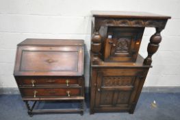 A SLIM REPRODUCTION OAK COURT CUPBOARD, with two cupboard doors, width 70cm x depth 45cm x height